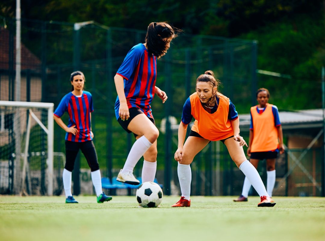 young-sportswomen-playing-soccer-on-training-at-th-2023-11-27-05-08-04-utc